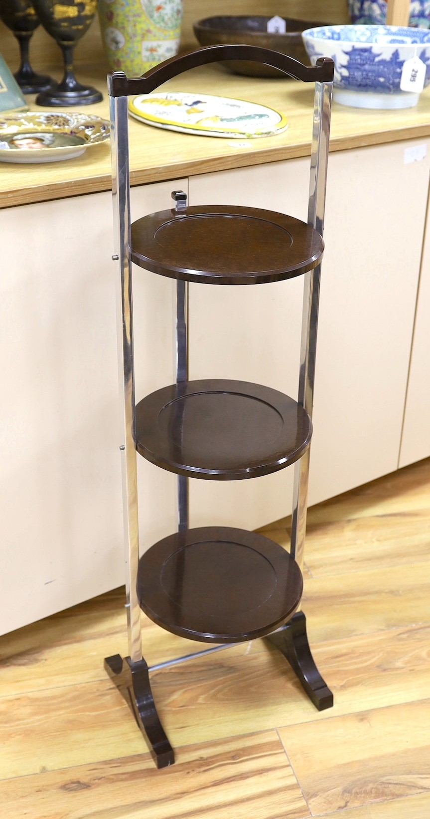 A Bakelite and chrome cake stand, 93cm